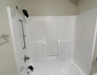 Damaged shower stall before restoration